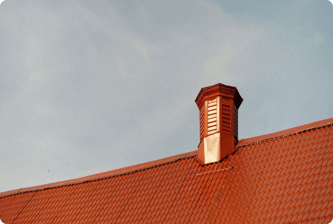 Red tiled roof with chimney vent