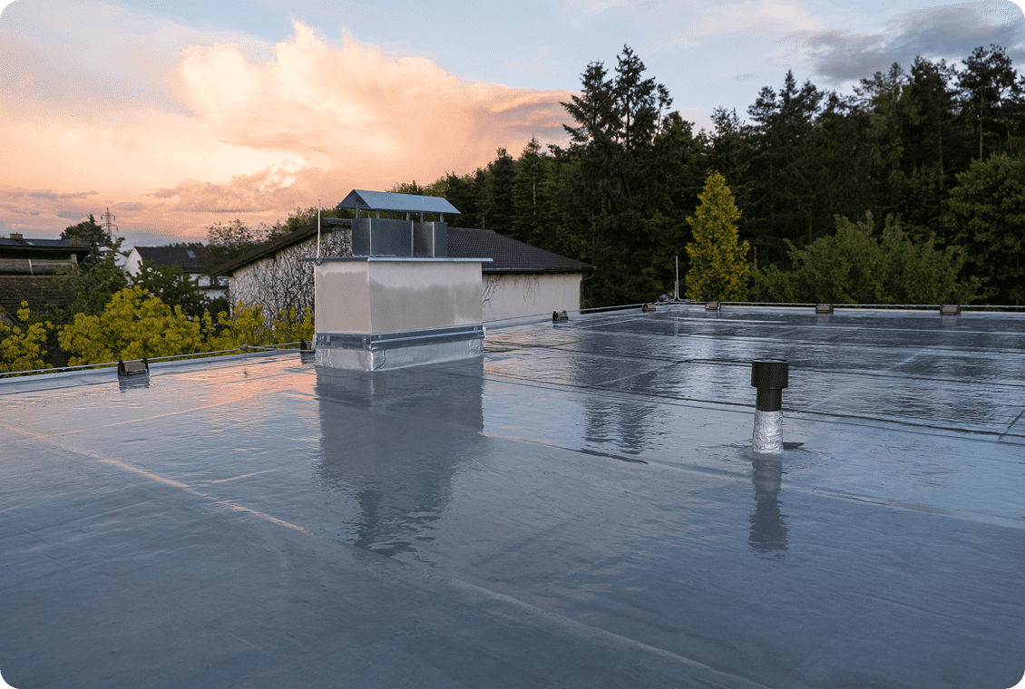 Rooftop reflecting sunset sky