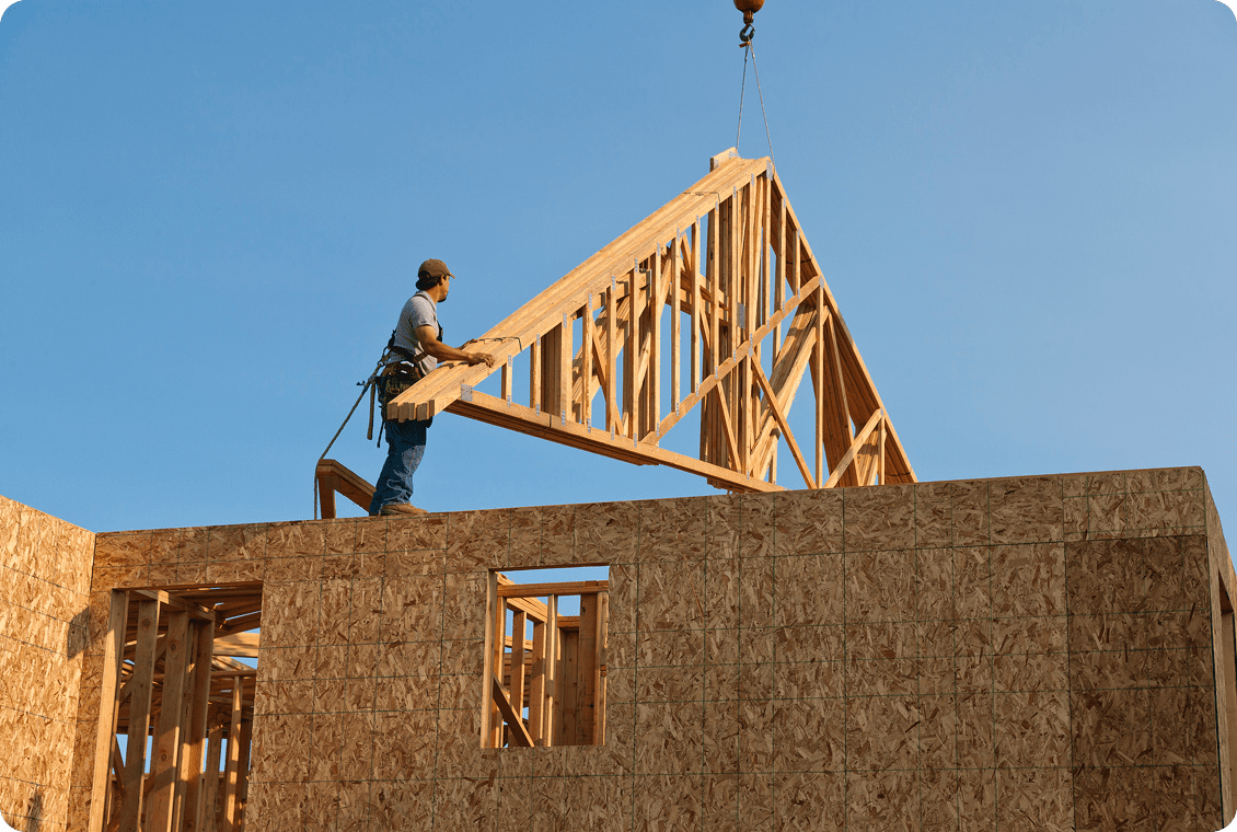 Carpenter working on wooden framework