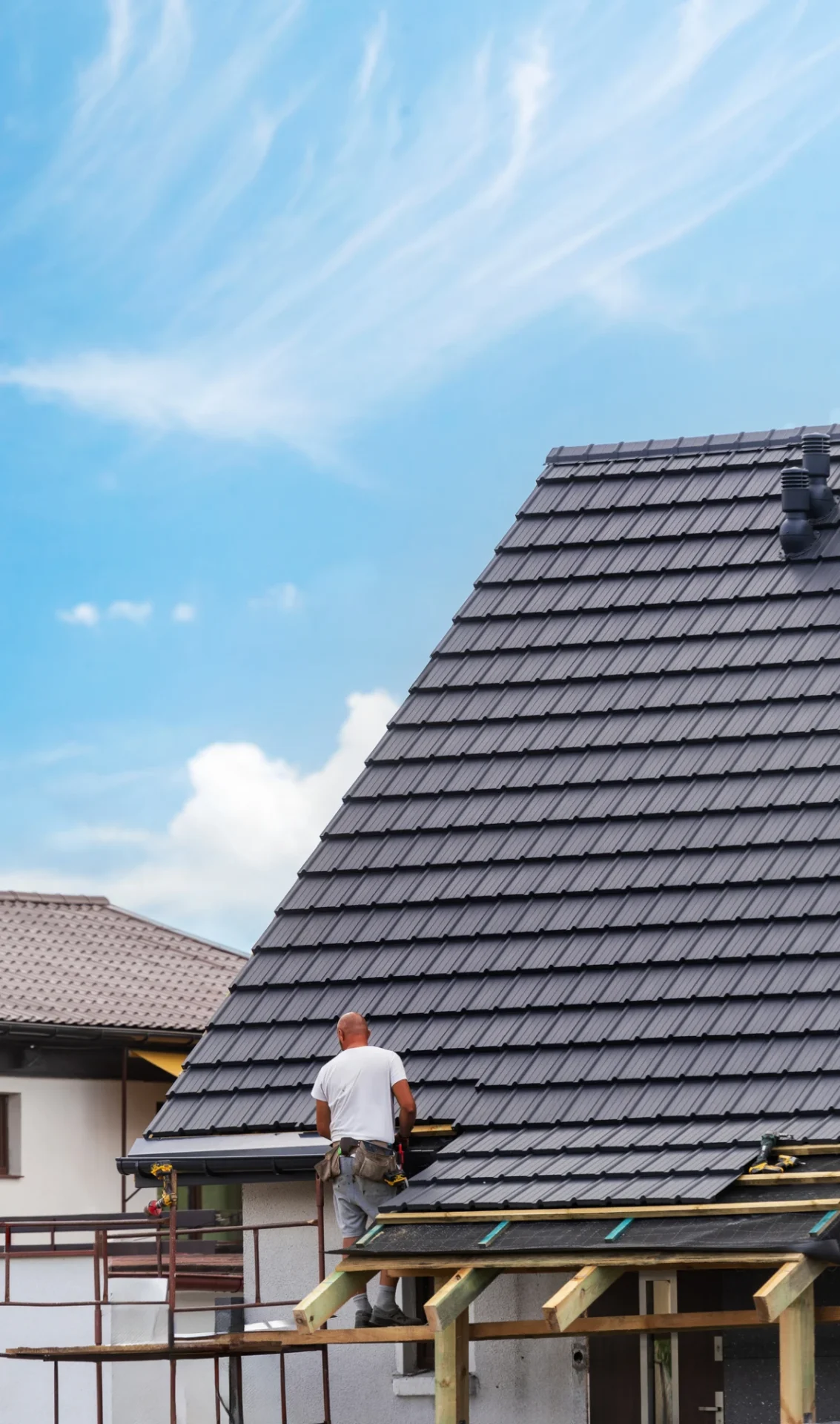 Man working on rooftop construction